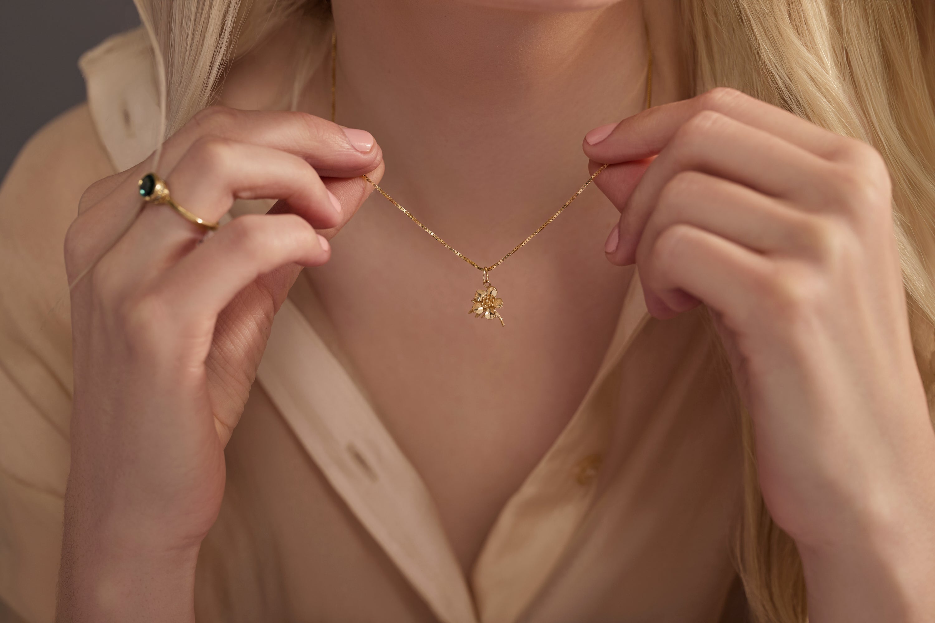 Auckland Mānuka charm, 14k recycled gold floral pendant, worn on a 14k gold chain, worn by model, Jewelry Charms Allison Alane