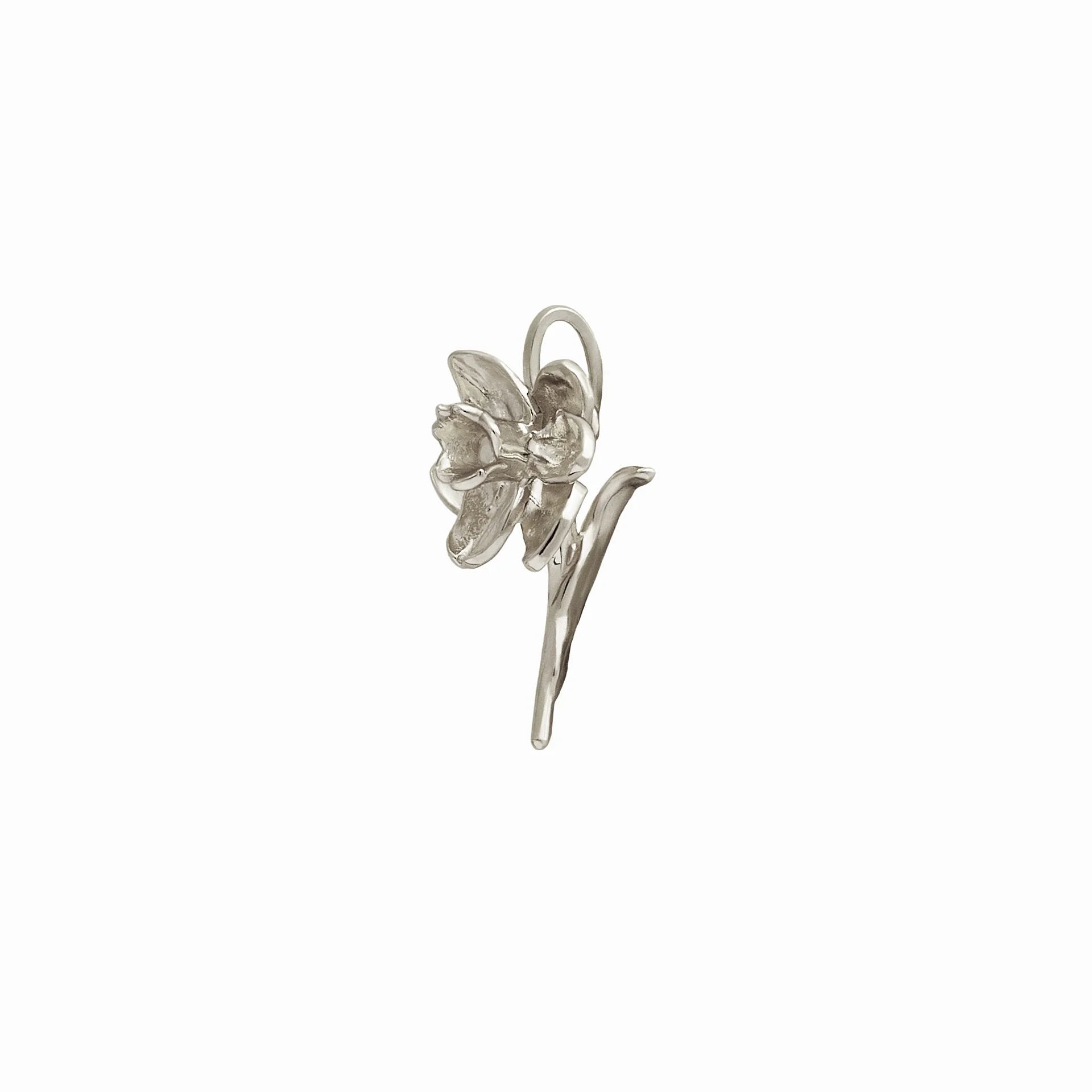 Silver daffodil charm on a white background.