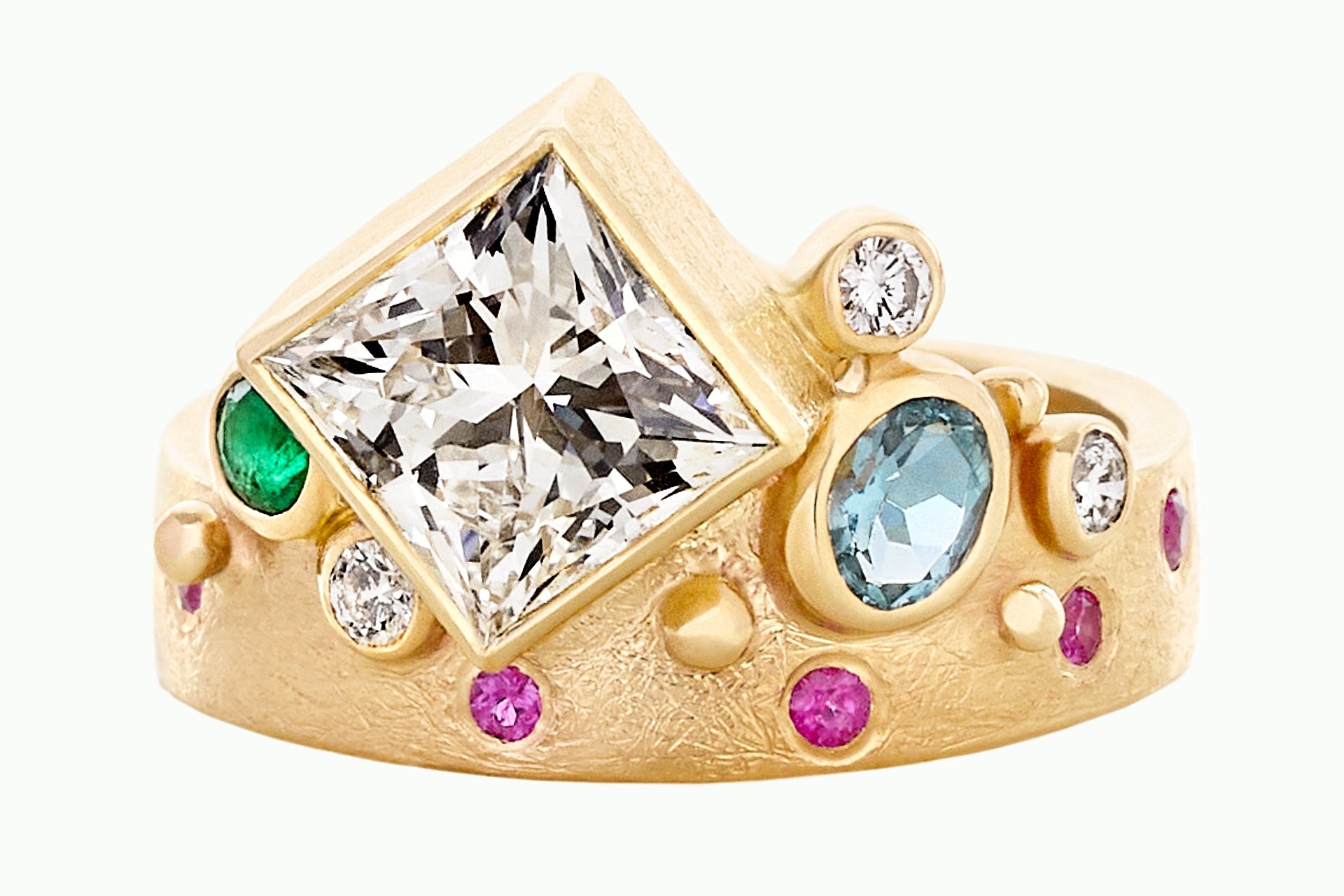 Gold ring with large central diamond, smaller diamonds, and colorful gemstones on a white background