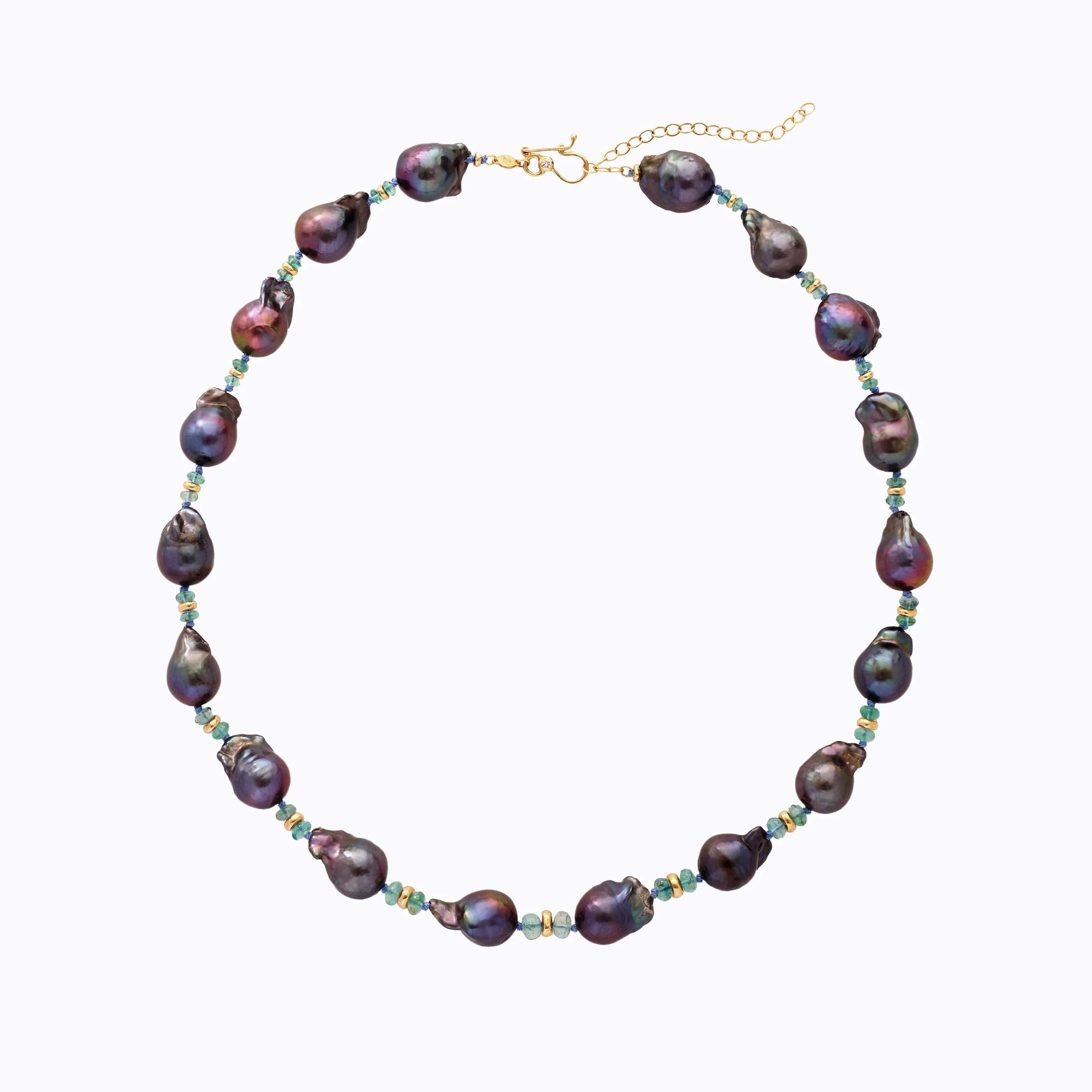 Pearl necklace with a gold clasp on a white background