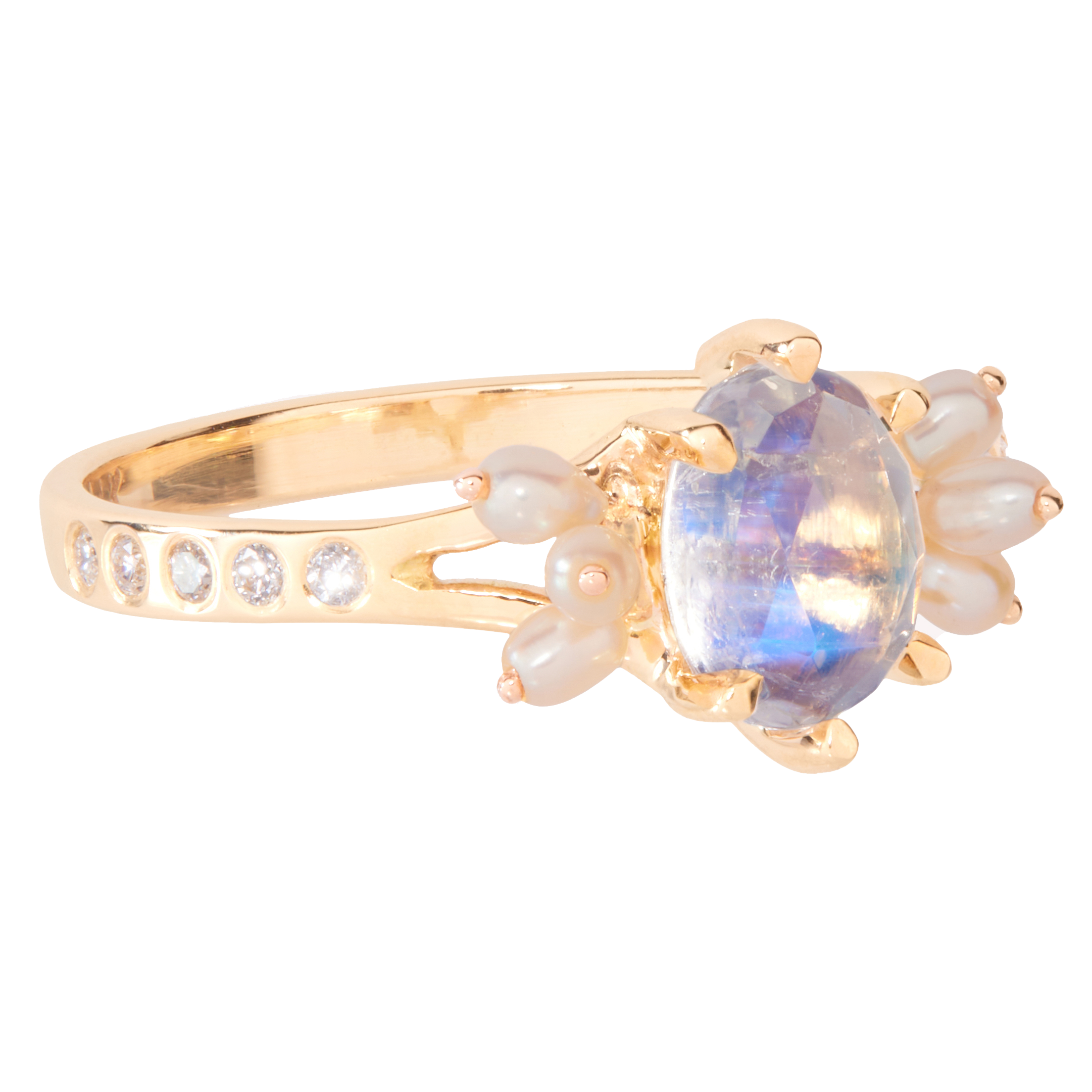 Gold ring with a central moonstone gemstone and pearl and diamond accents on a white background