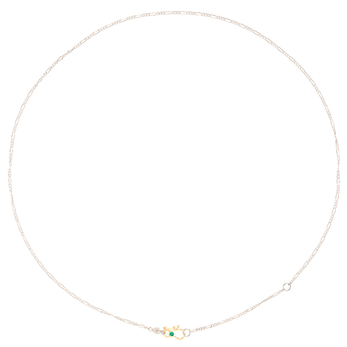 A delicate silver chain necklace with a small gold clasp featuring a tiny green gemstone, displayed on a clean white background.