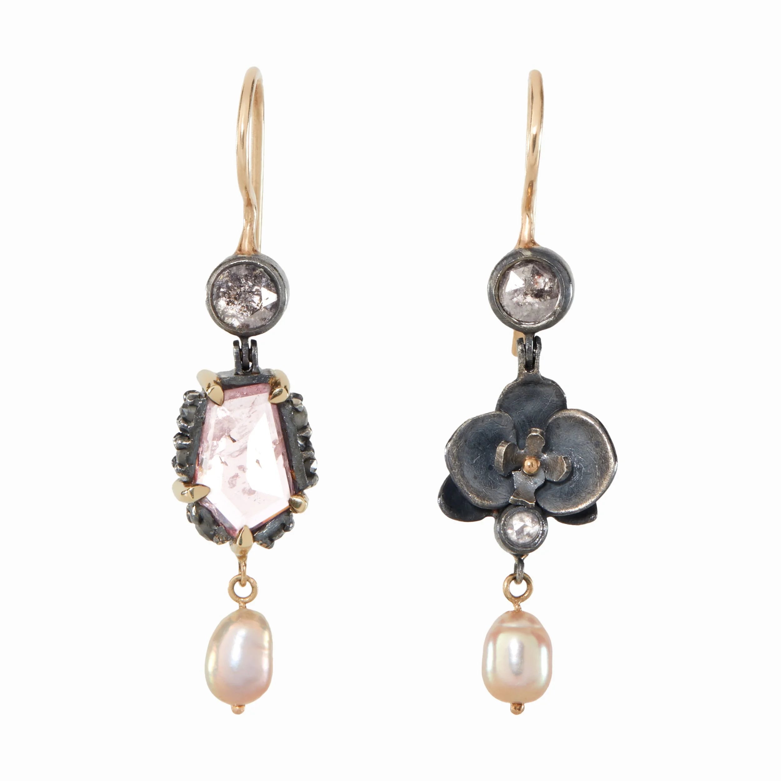 Pair of earrings with floral and gemstone designs on a white background