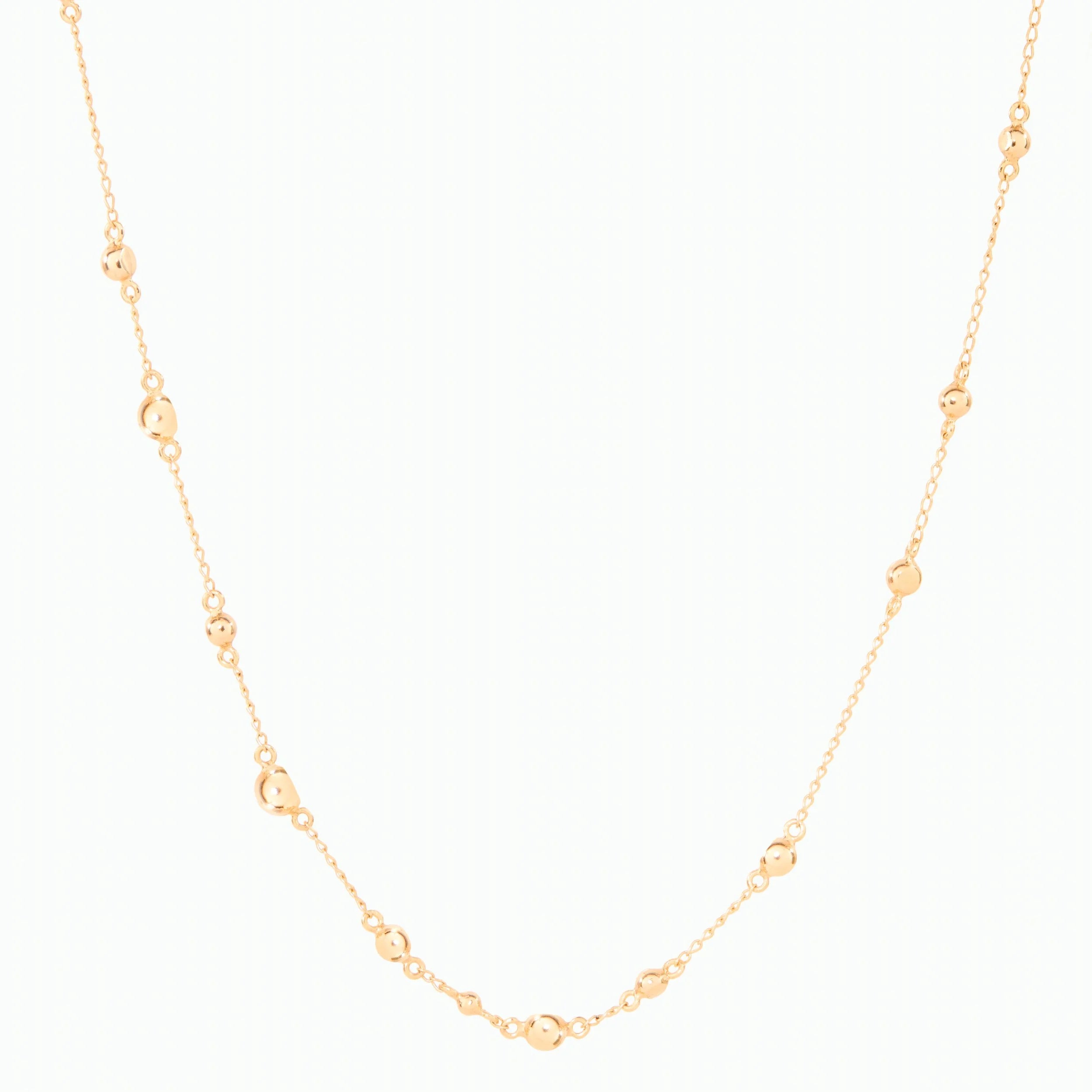 Gold necklace on a white background