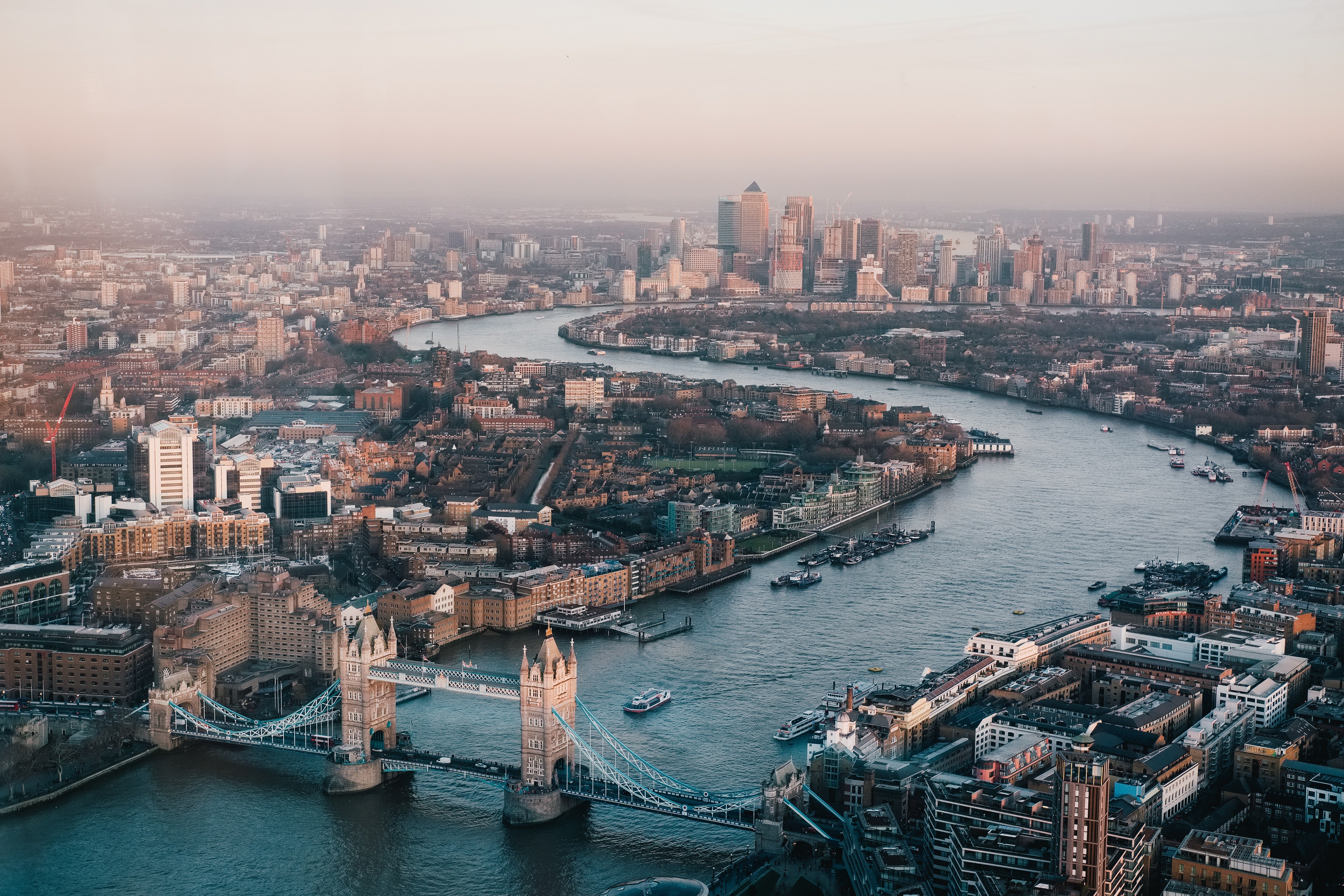 Aerial view of London with river Thames and a prominent Castle Bridge.