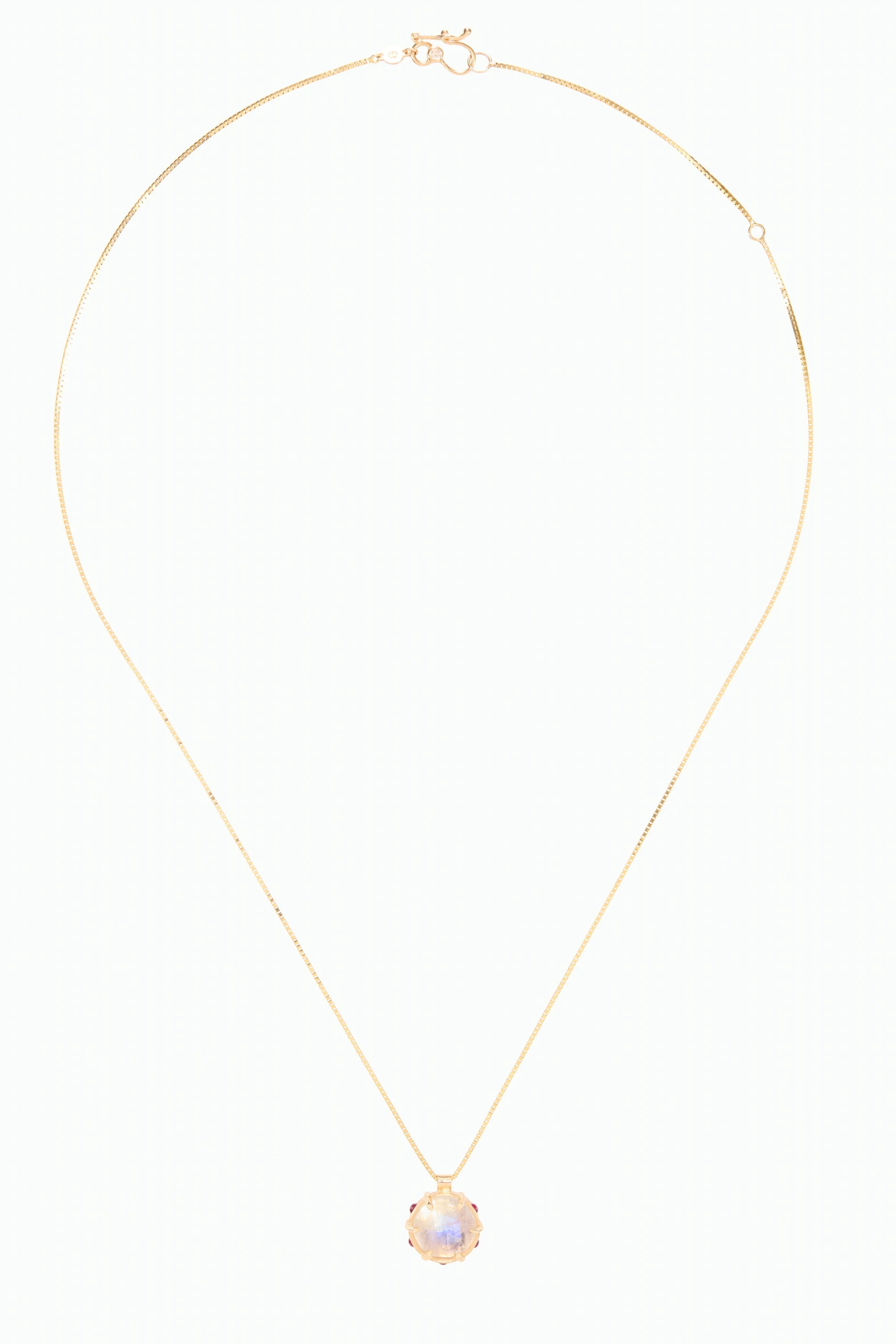 Gold necklace with a pendant on a white background