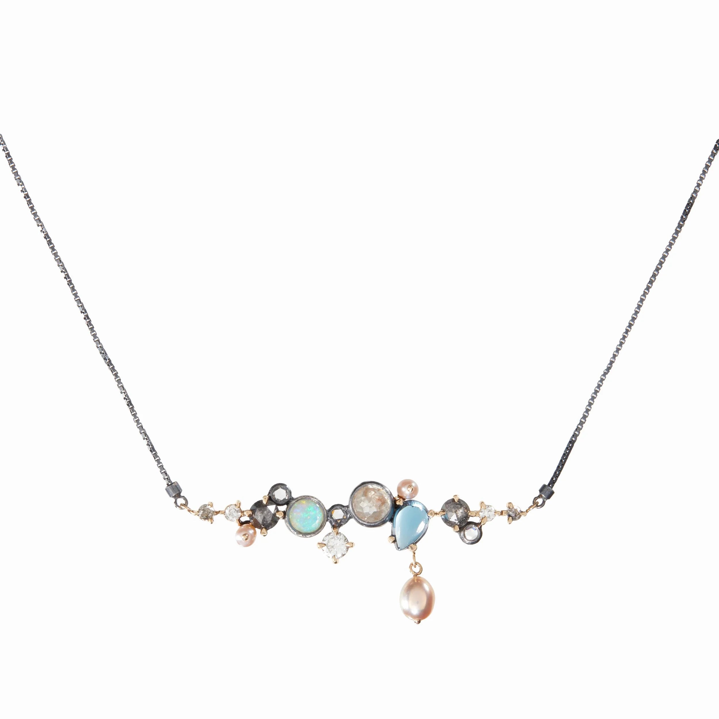 Necklace with multicolored gemstones on a white background