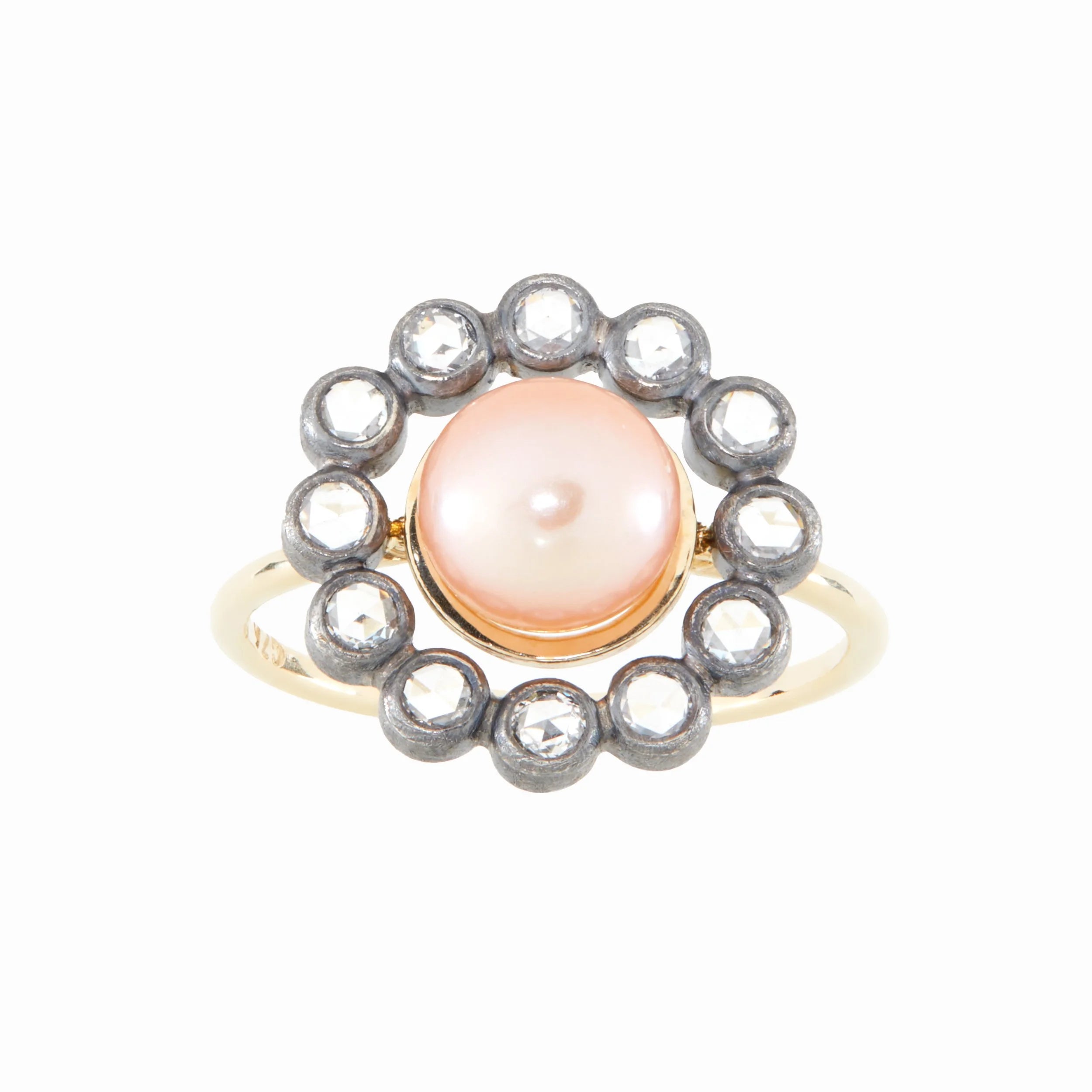 Ring with a central pearl and diamond stones on a white background
