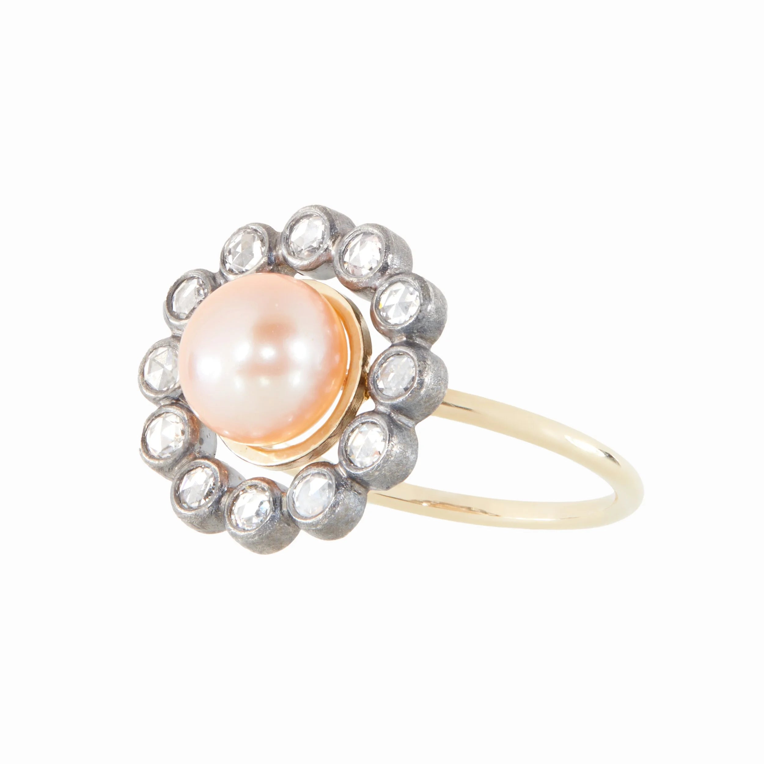 Ring with a pink pearl and diamond stones on a white background