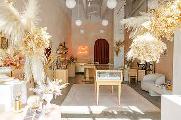 Modern interior design with white decor, furniture, and lighting fixtures.
