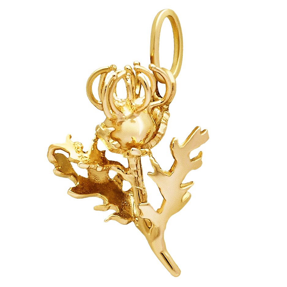 Gold orchid charm on a white background