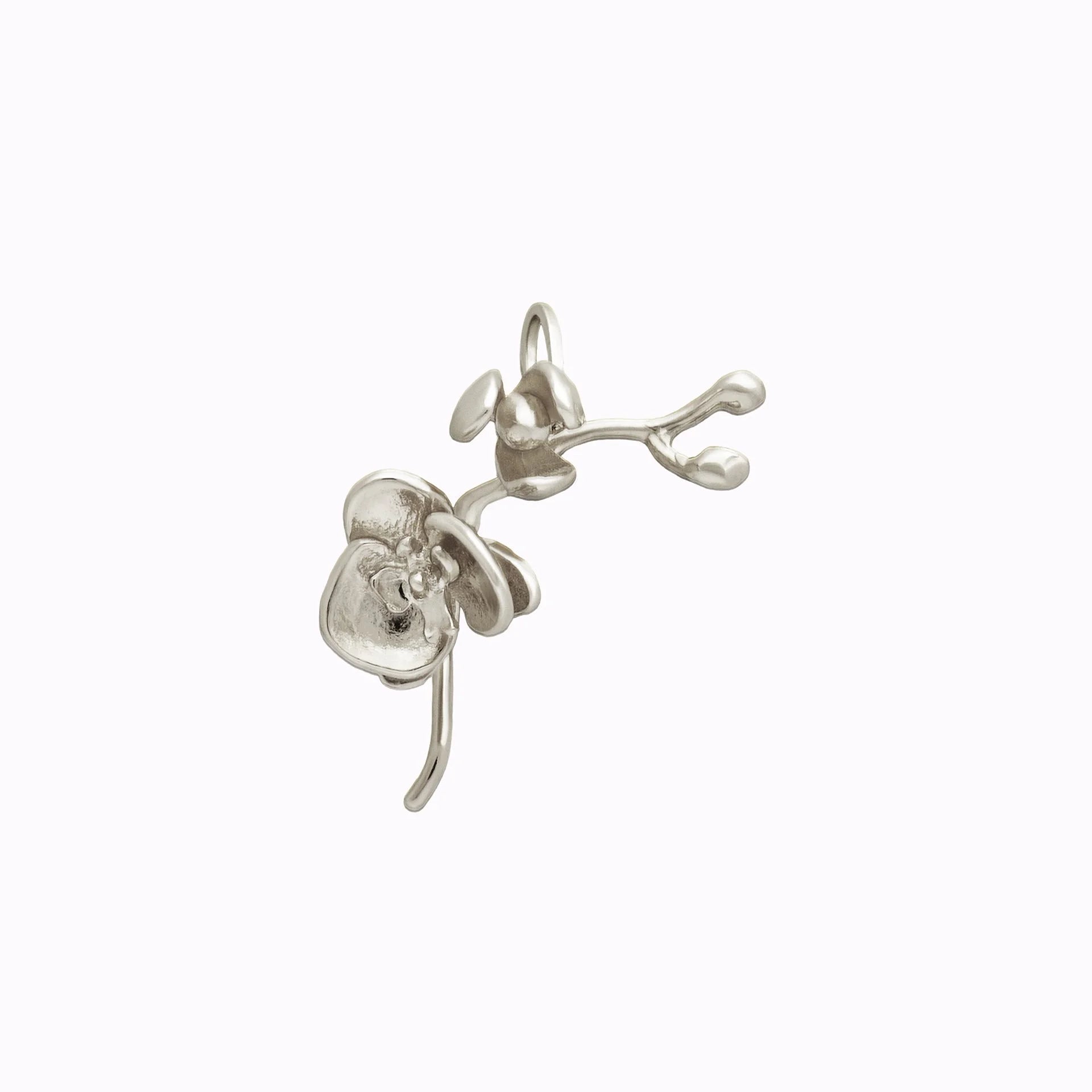 Silver orchid charm on a white background
