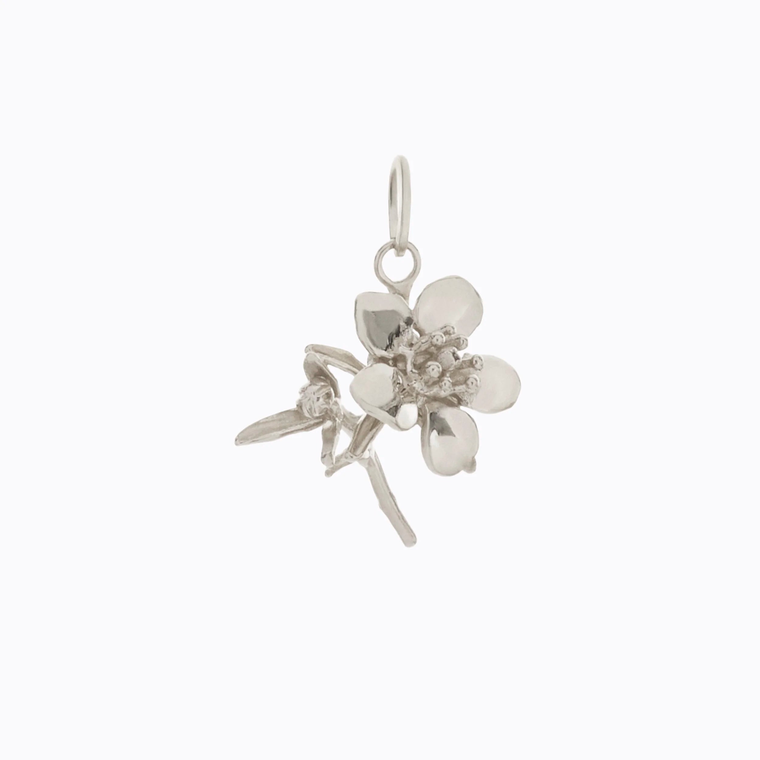 Silver floral pendant on a white background