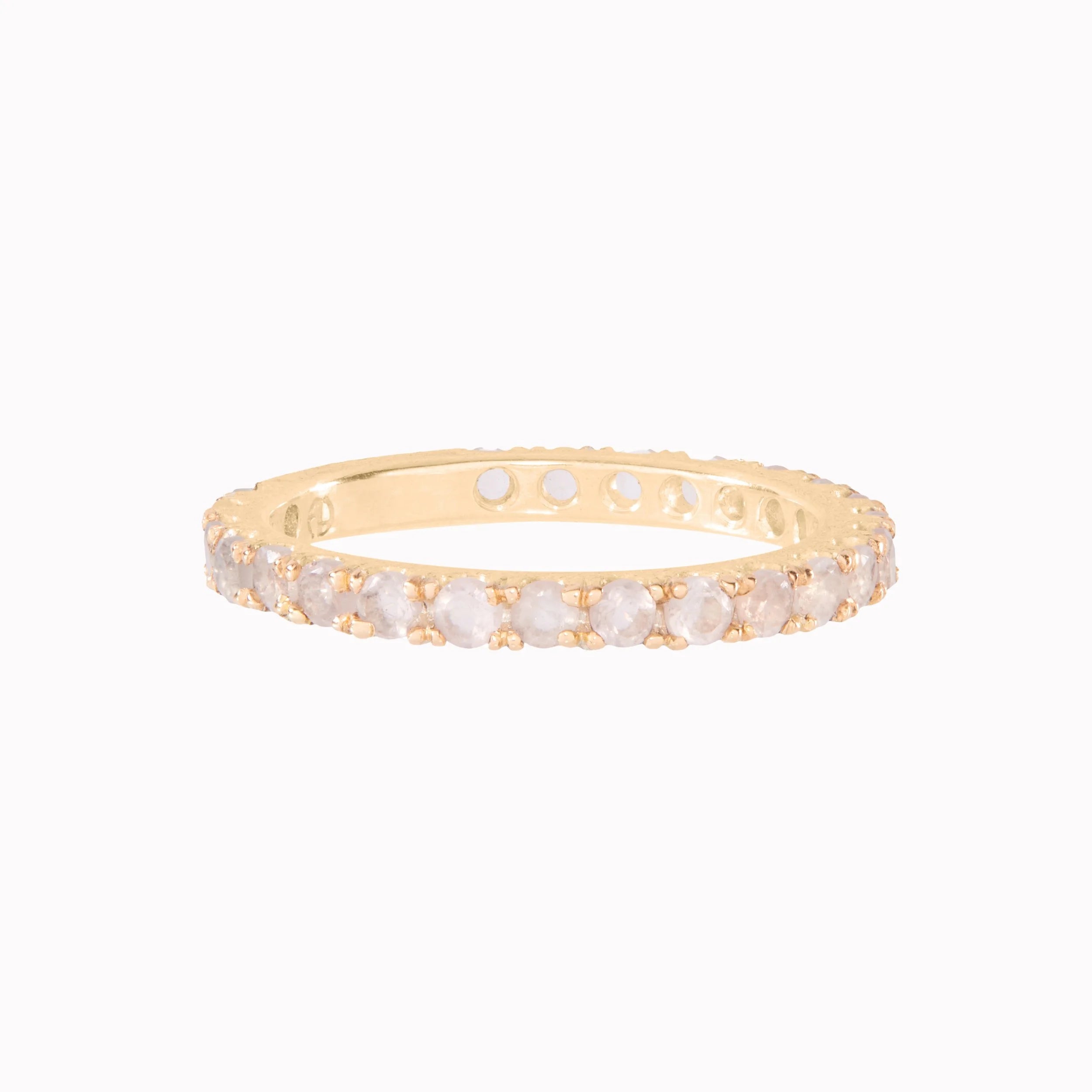 Gold ring with small stones on a white background