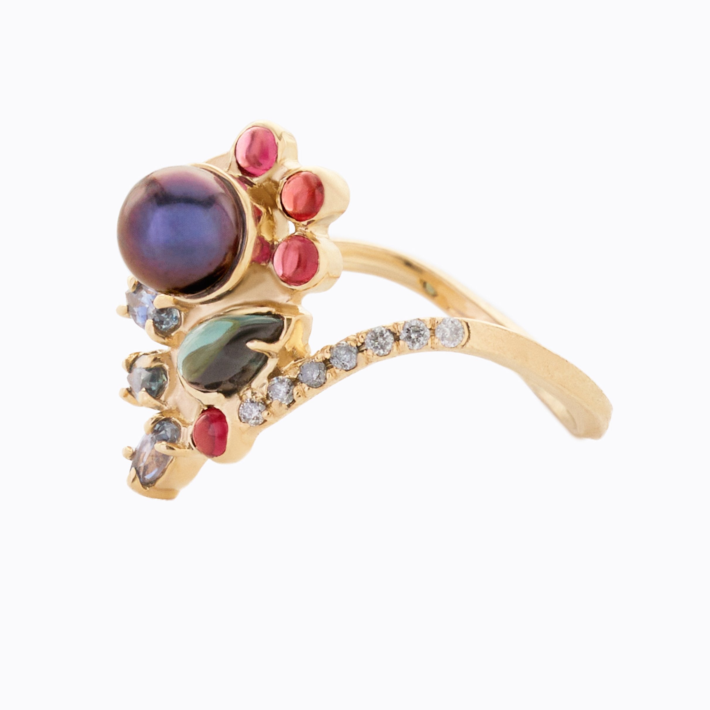 Gold ring with multicolored gemstones on a white background