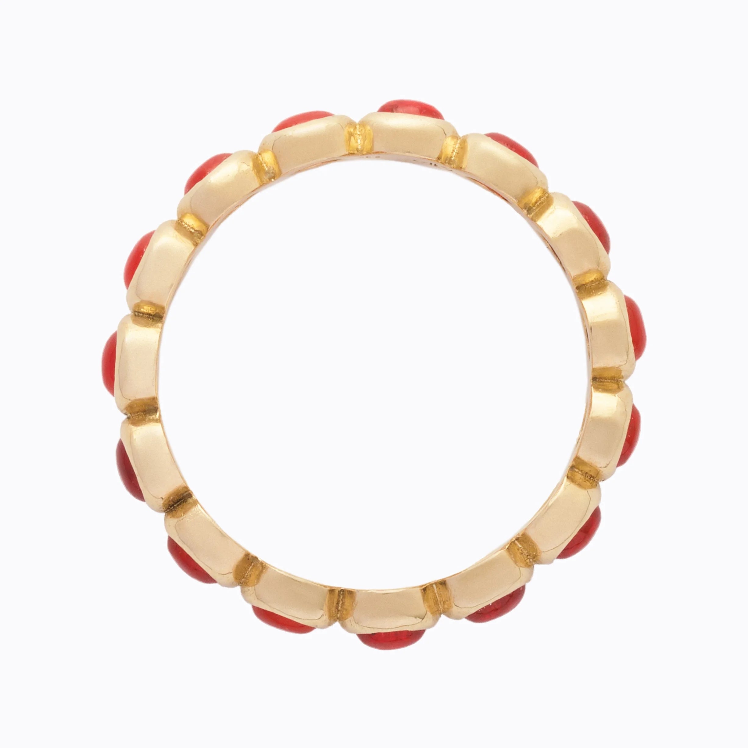 Gold ring with orange opals on a white background