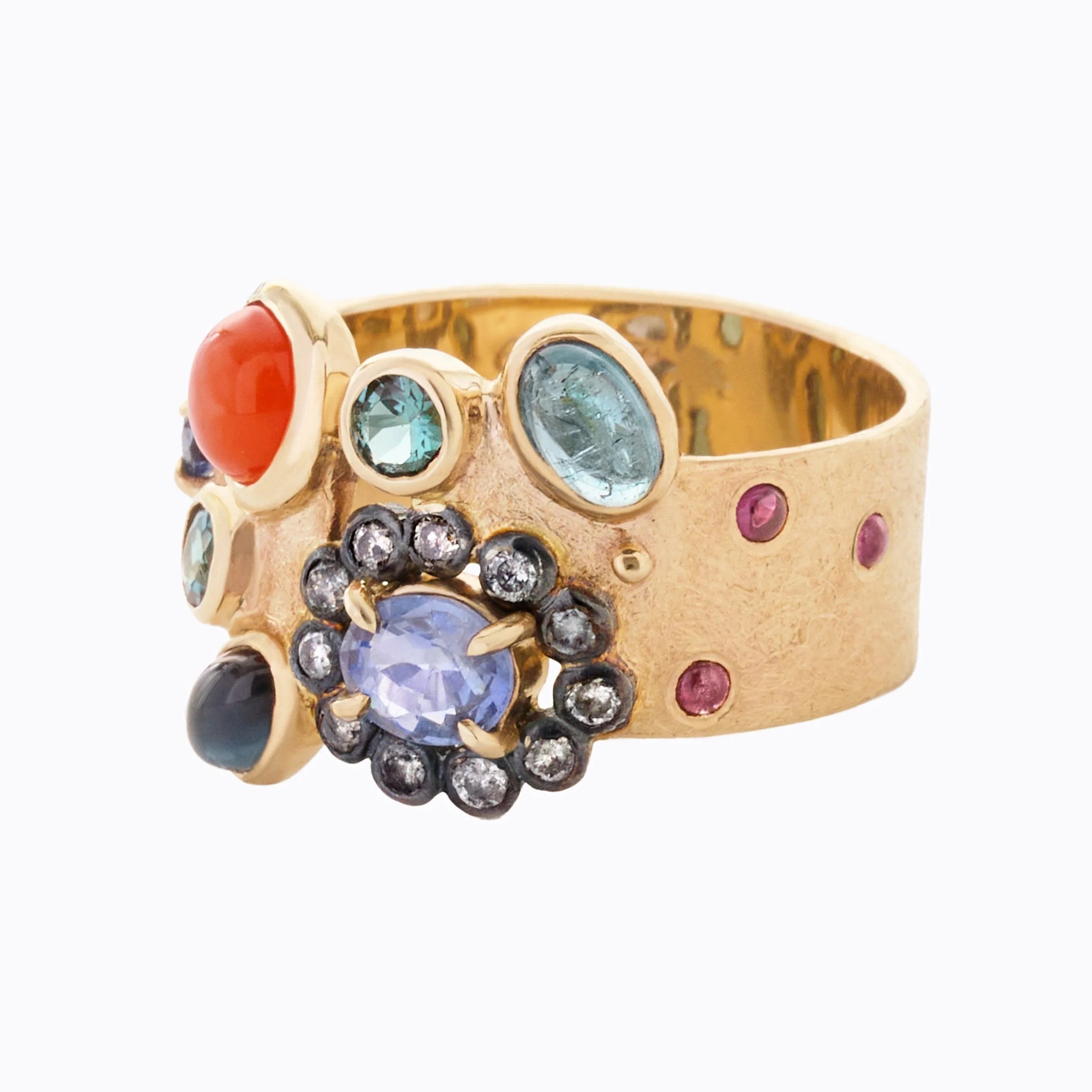 Gold ring with multicolored gemstones on a white background