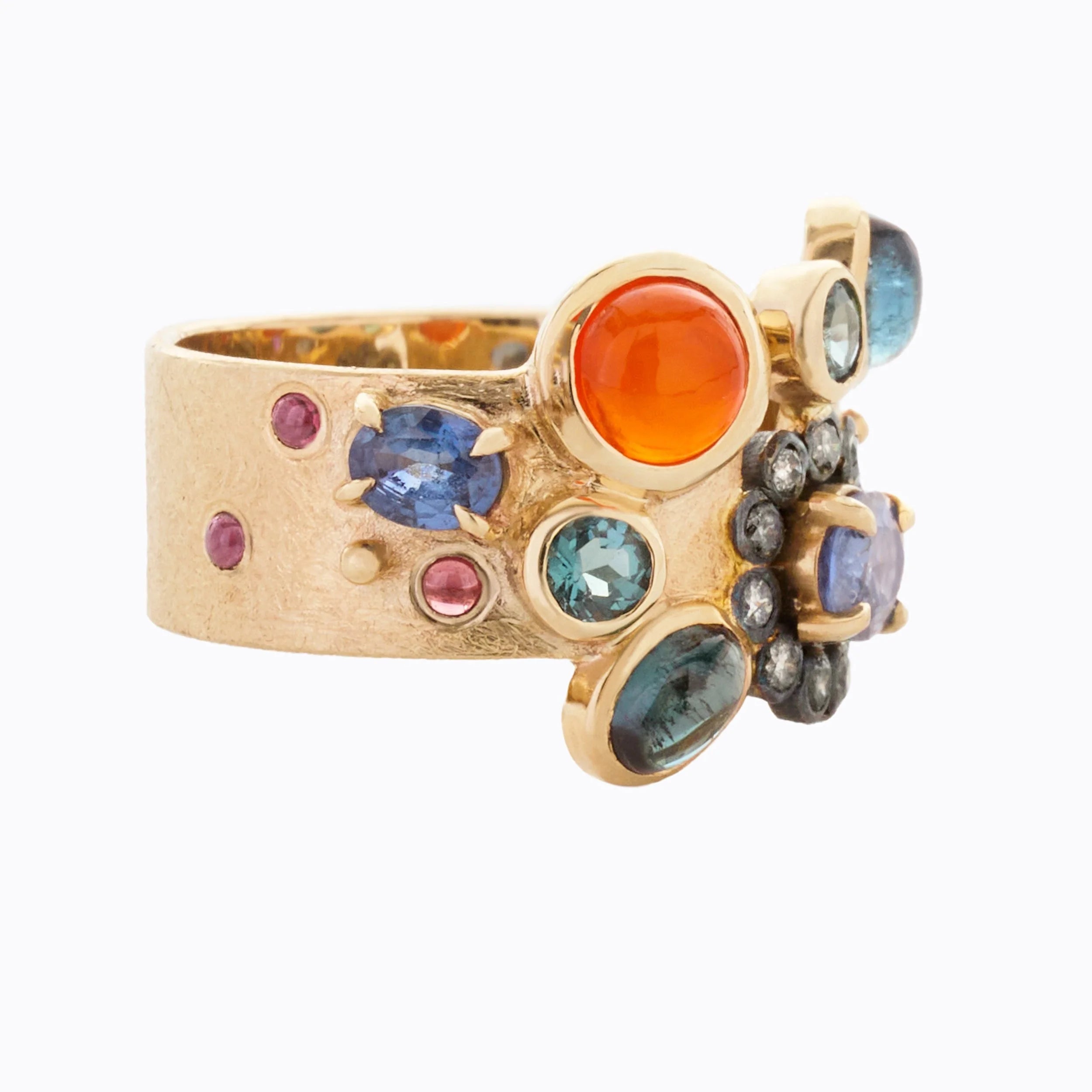 Gold ring with multicolored gemstones on a white background