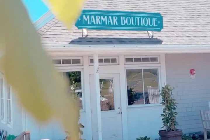 Marmar Boutique with a blue sign on a building exterior