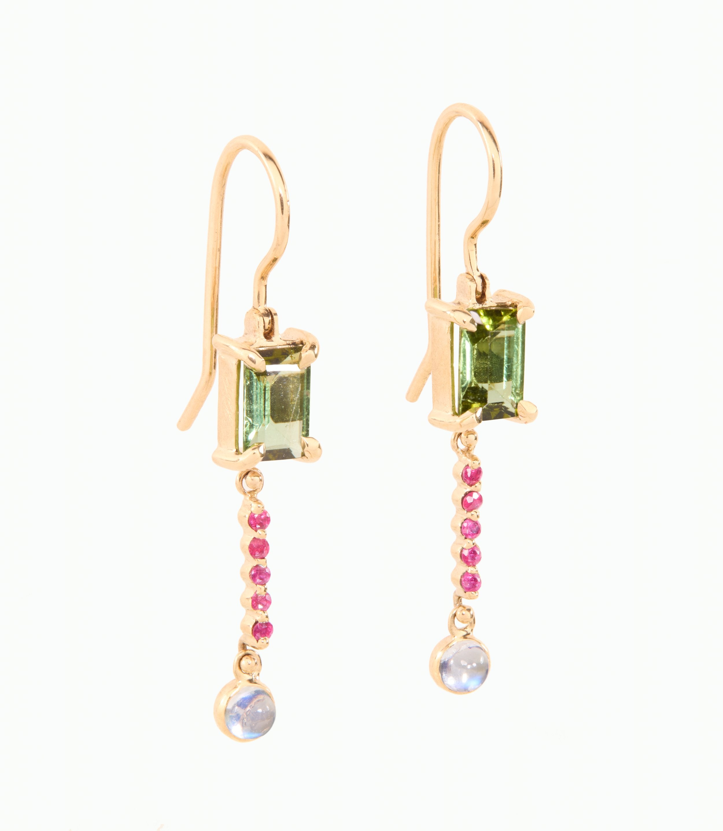 Gold earrings with green and pink gemstones on a white background