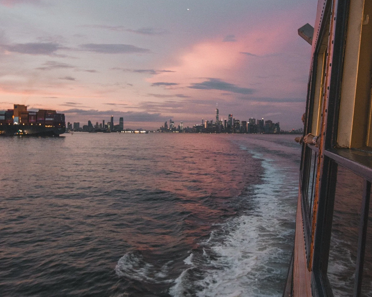 City skyline at sunset with water reflections
